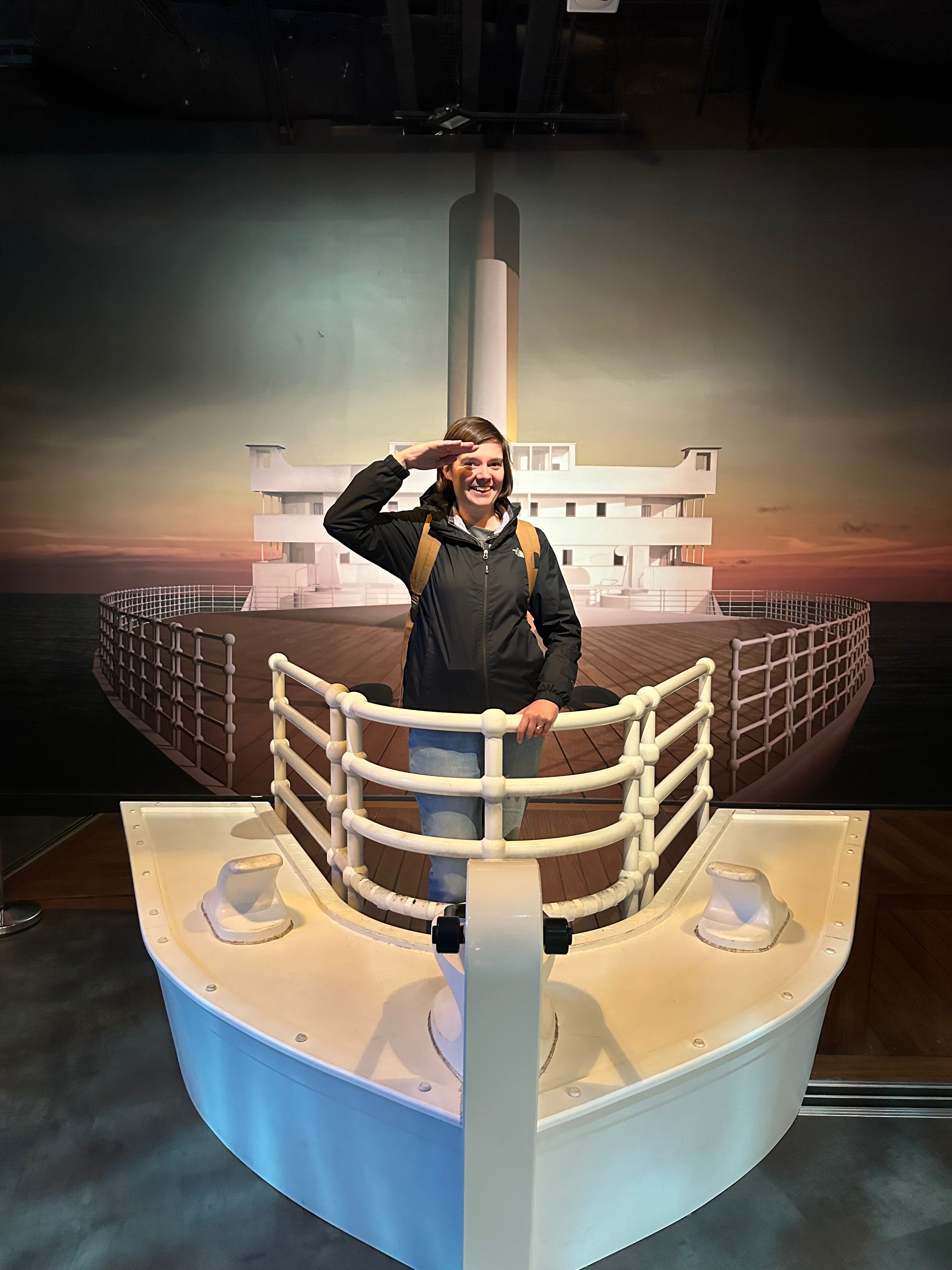 A woman making a salute on the Titanic at the Titanic Museum